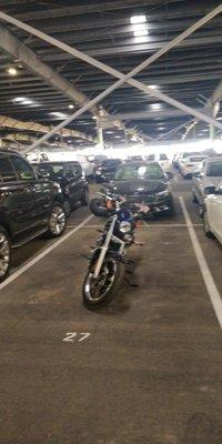 A fuzzy photo of my non-fuzzy bike in a non-fuzzy covered lot.