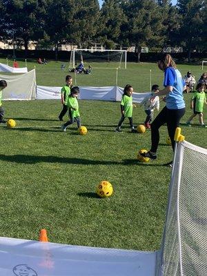 Our 3yo's working on keeping the ball close to their feet