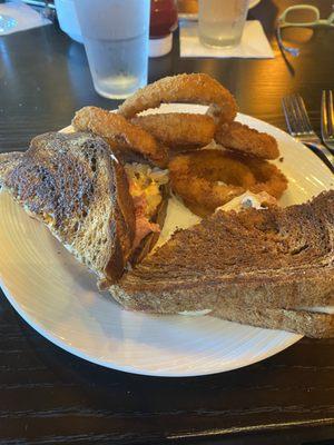 Reuben Sandwich and onion rings.