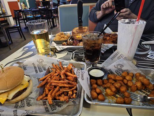 Cauliflower wings, sweet potato fries, onion ring burger.