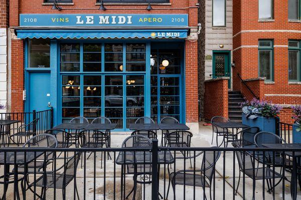 Le Midi storefront and patio on Division Street in Wicker Park, Chicago