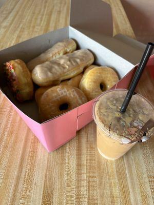 Half dozen donuts and Vietnamese iced coffee