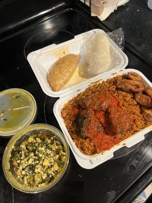 jollof rice w/ beef, side of egusi, meat pie & iyan (fufu)