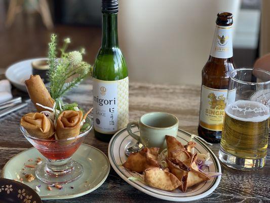 Crispy rolls, Crab Rangoons, and some silky Sake & Singha! Beautiful plate ware to boot!