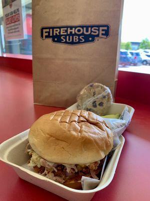 Pork and slaw on a Hawaiian roll with a cookie