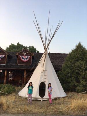 Ti & Ali standing at the teepee in front of the Custer Battlefield Trading Post