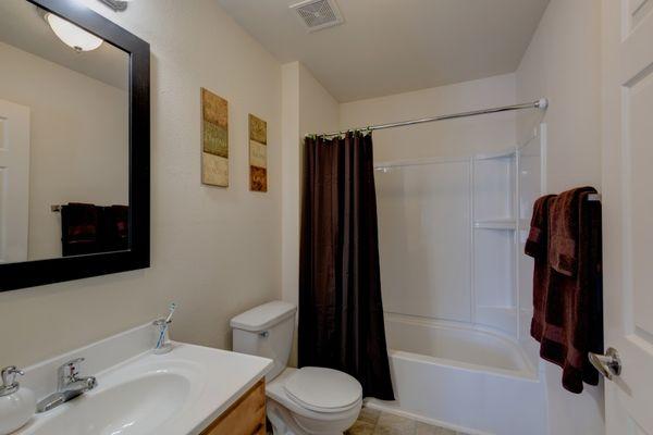 Private bedroom suite includes a private bathroom with a shower/tub combination.