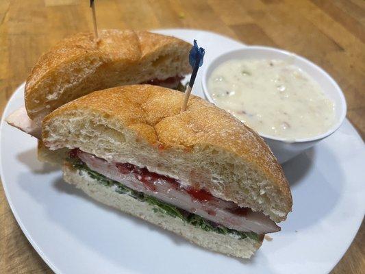 Smoked Turkey with Cranberry Sauce, Cream Cheese and Veggies on a toasted Ciabatta Bun with Clam Chowder