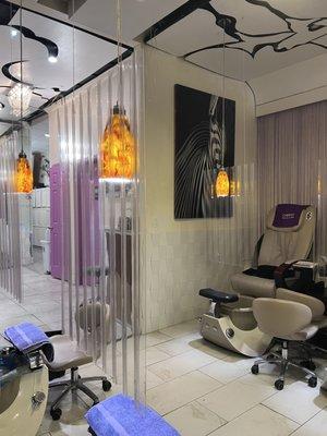 Spa pedicure area, leading towards the back of the salon