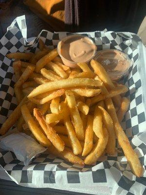 Generous order of delicious fries with plenty of sauce or catsup!