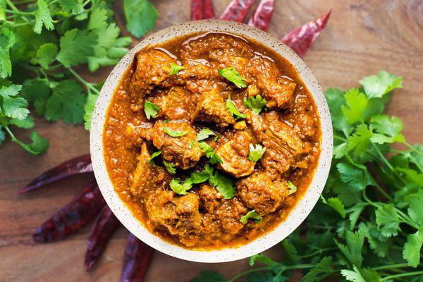 Goat Curry - Goat pieces marinated and then cooked in a medium spicy thick gravy