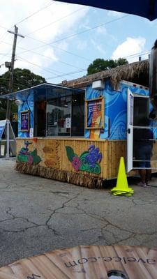 Looks like a food truck.  Cute little stand.  We can never pass up Shaved Ice...heavy on the cream!