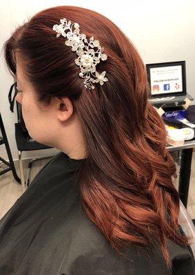 Bridal hairdo with decorative comb accent