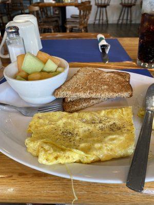 Swiss cheese omelette with fruit cup and wheat  toast