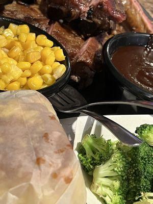 Slab of ribs and two Sides (corn and broccoli) with corn bread.