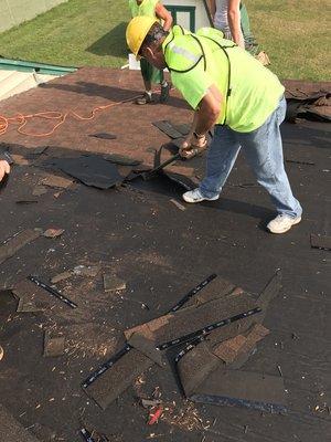 Being the boss doesn't exempt me from tearing off old shingles.