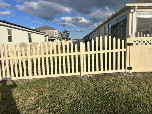 Tan 4 foot picket scalloped fence