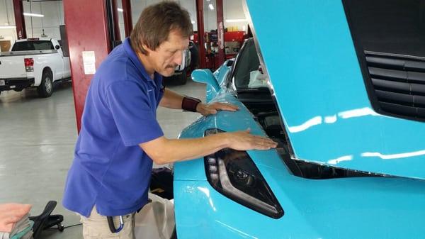 Kevin installing paint protection film.