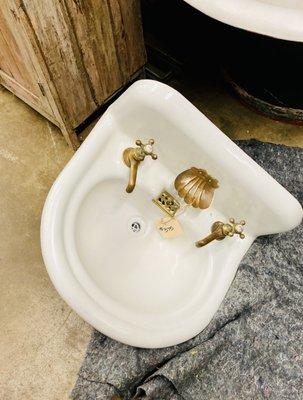 LOVE my little antique seashell sink! Will post some pics when I get it installed.