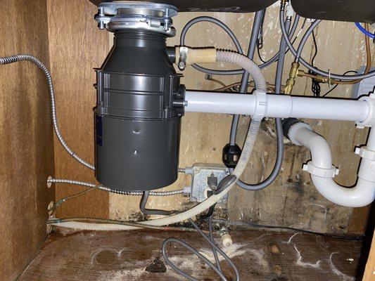 replaced old garbage disposal and the under sink tubular.