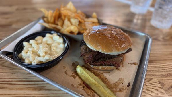 Brisket sandwich with a side of house made chips and Mac and cheese!!