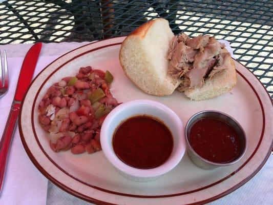 Absolutely PERFECT jerked pork sandwich. Hot sauce is amazing and the red beans over rice couldn't have been better. Love it!