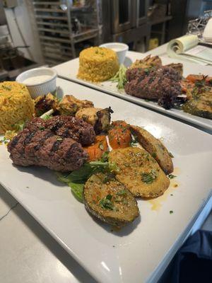 Beef kofta and chicken kebab mix platter, served with Mediterranean pilaf rice and grilled medley of vegetables