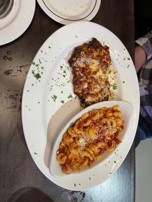 CHICKEN PARMIGIANO Two chicken cutlets breaded in herbed focaccia crumbs, topped with house-made marinara and fresh mozzarella cheese.