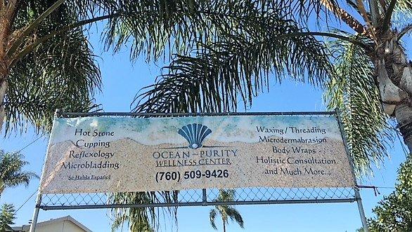 The Banner from the street with the Ocean Blue Sky behind.