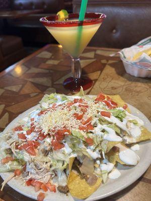 The nachos were awesome and the Margarita was amazing!