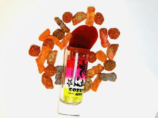 Shot of chamoy with some of our popular dulces enchilados!