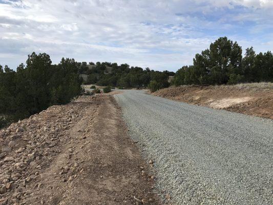 New road from start to finish after utilities were installed, which we trenched for and backfilled.