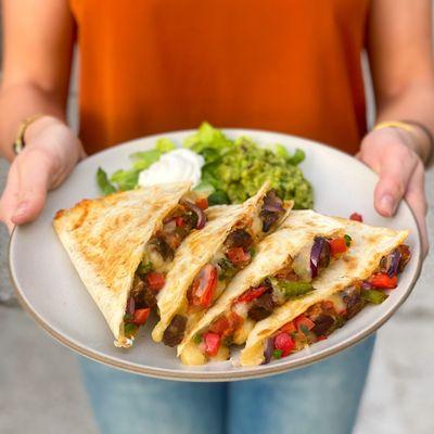 Grilled quesadillas are stuffed with chef-selected ingredients like grilled steak and hand-sliced,
sautéed-in-house fajita ve...