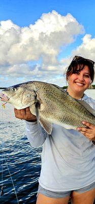 Alondra Fleming-Parra with a black drum caught on Fishbites!