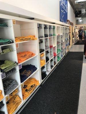 Wall of t-shirts and decor