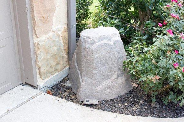 Fake rock covering a water filtration system installation for the whole house. Each water fixture has filtered "bottle water"...