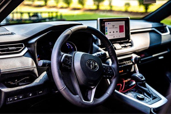 Interior of my RAV SE Hybrid (notice the red cord was an extra feature to plug in my phone...you can get a wireless charger added)