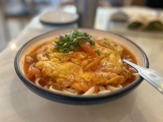 Egg with tomato over knife cut noodz