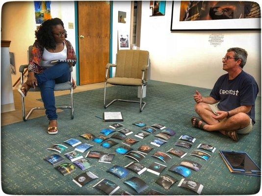 Asha and underwater photographer Steven Miller prepare for the FotoFocus 2018 exhibit in our Mohawk Gallery.