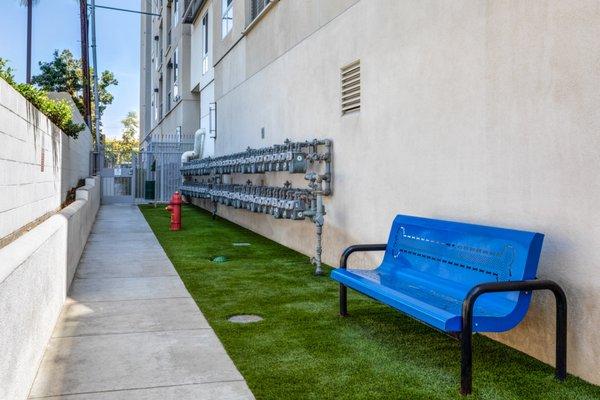 Dog run with fire hydrant and a bench.