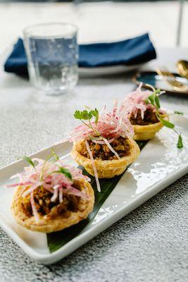 Chicken curry tart - sautéed minced chicken with curry powder, caramelized onion, sweet radish on top of crispy tart