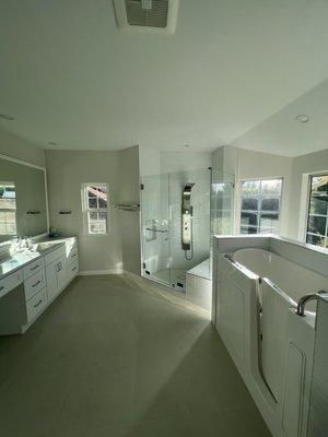 Side by side walk in shower and walk in tub in Porter Ranch