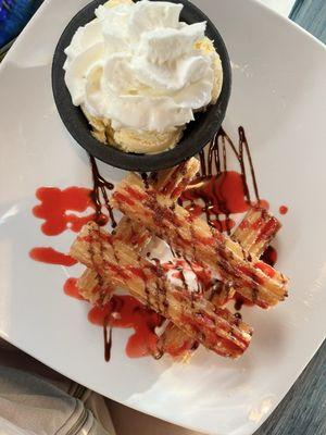 Warm Churros and ice cream with a strawberry chocolate sauce drizzle! Yummmm