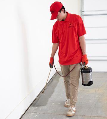 Spraying inside the garage of a home in Queen Creek.