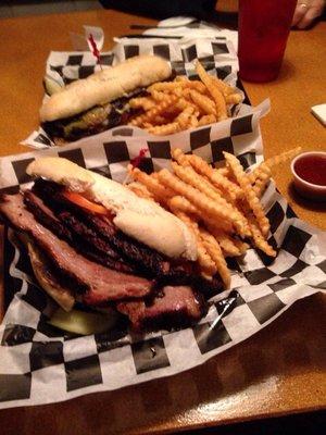 Brisket sandwich in front with ribeye sandwich in back.