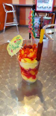 Mangonada is shaved mango and chamoy ice and fresh mango. I had them add the juice of a lime, very good once everything is mixed together!