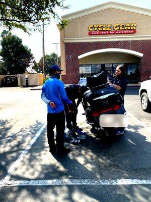 David & Brandon assisting a poor rider to get back on the road.