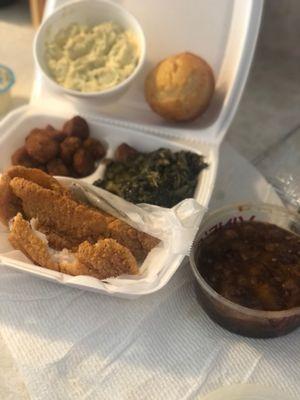 Fried catfish, fried okra, greens, cornbread, potato salad, sweet potato pecan casserole