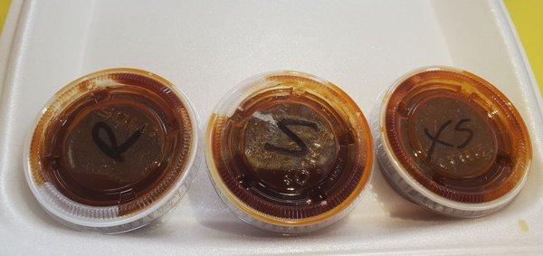 Bbq sauces from left to right. Regular, Spicy, and Extra Spicy.