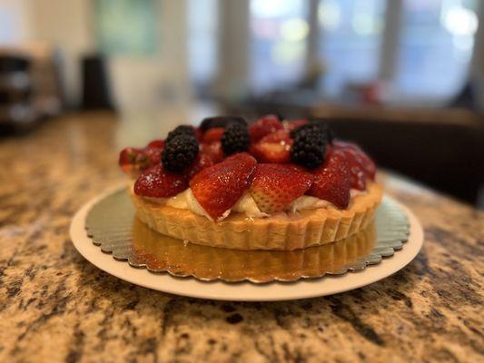 Custom fruit tart with strawberries, raspberries, and blackberries.